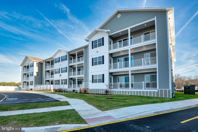 a view of a building with a yard