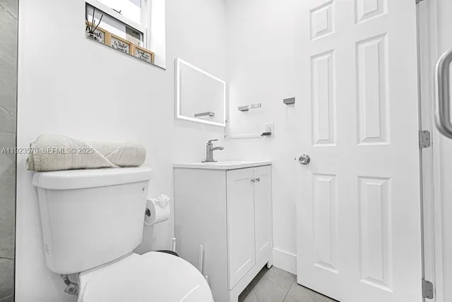 a bathroom with a toilet and a sink