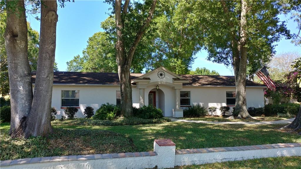 7613 Barry Road Tampa, FL 33615 - Photo 1 of 1 gorgeous 1/2 acre lot, professionally landscaped, irrigation system on well, house on municipal water, updated windows, front door and entry portico