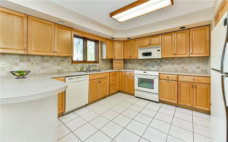 303 Ridgeway Drive Wexford, PA 15090 - Photo 7 of 21 Fully equipped kitchen with window above sink and plenty of cabinet space.