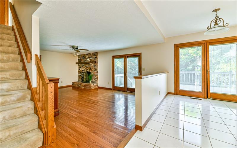 303 Ridgeway Drive Wexford, PA 15090 - Photo 8 of 21 Kitchen opens to family room with floor to ceiling brick cozy wood burning fireplace and sliding door that leads to oversized deck.