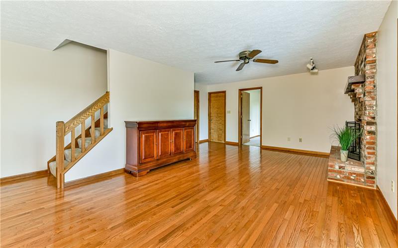303 Ridgeway Drive Wexford, PA 15090 - Photo 9 of 21 Gleaming hardwood flooring in this family room.