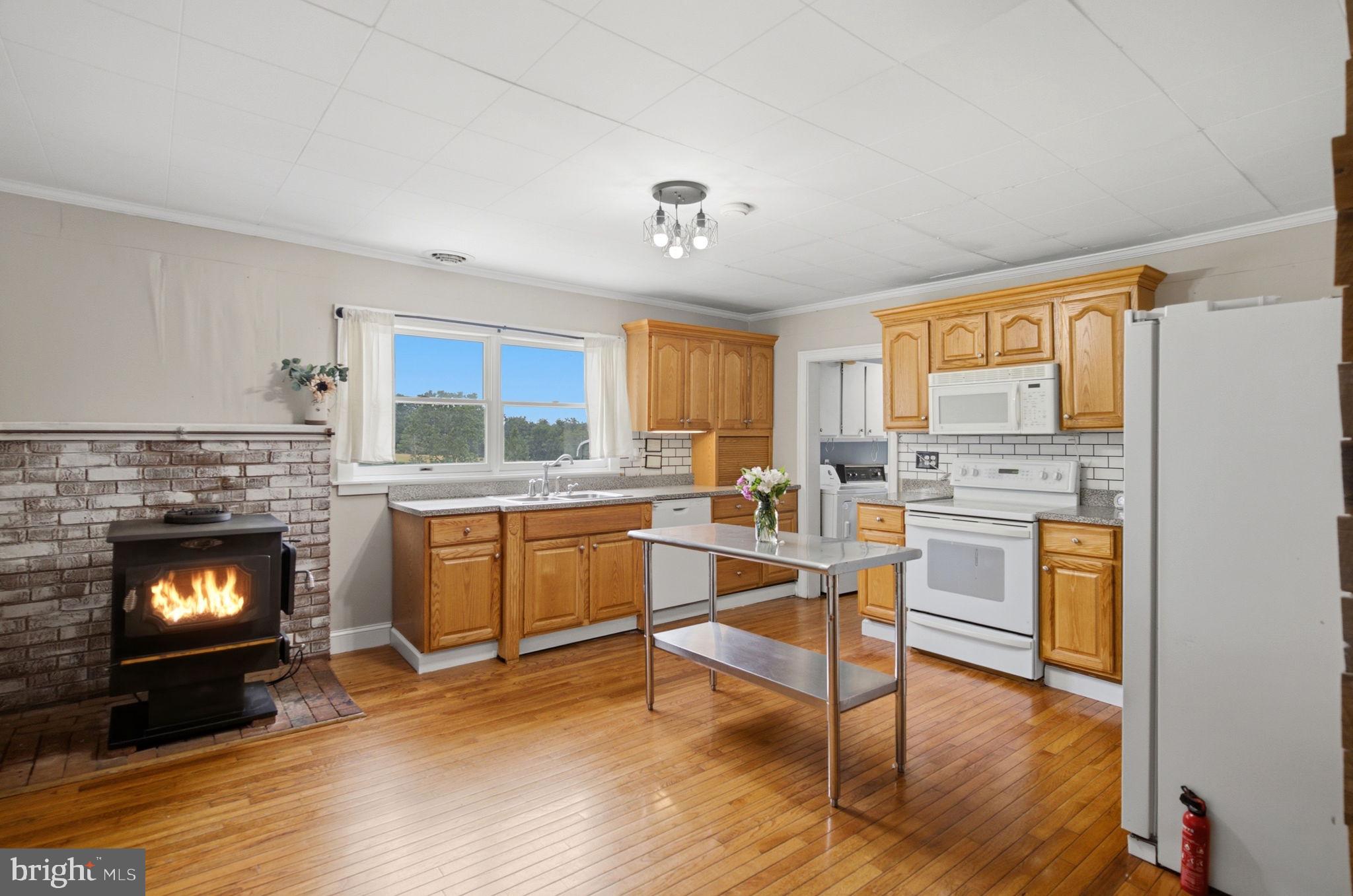 2197 Mauzy Road Berkeley Springs, WV 25411 - Photo 21 of 119 Kiitchen with wood stove
