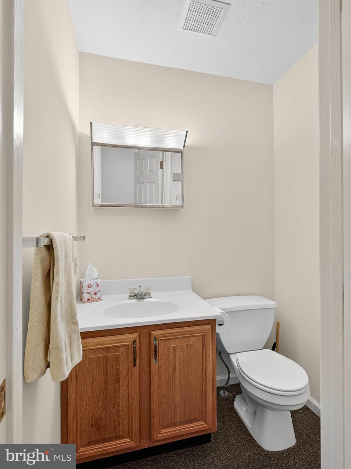 427 Crosswinds Drive Lititz, PA 17543 - Photo 15 of 33 a bathroom with a granite countertop toilet sink and mirror