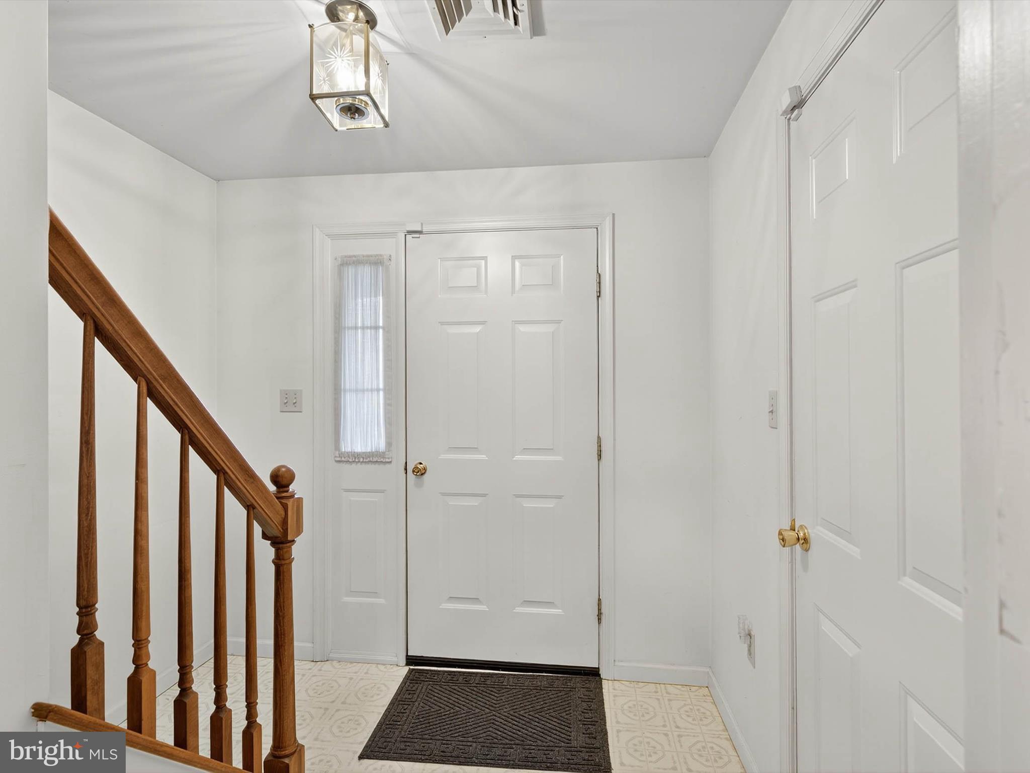 427 Crosswinds Drive Lititz, PA 17543 - Photo 8 of 33 a view of a hallway with wooden floor and staircase