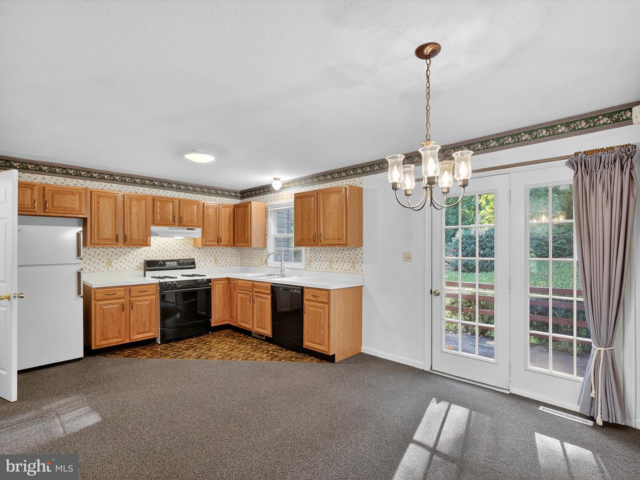 427 Crosswinds Drive Lititz, PA 17543 - Photo 10 of 33 a kitchen with refrigerator and window