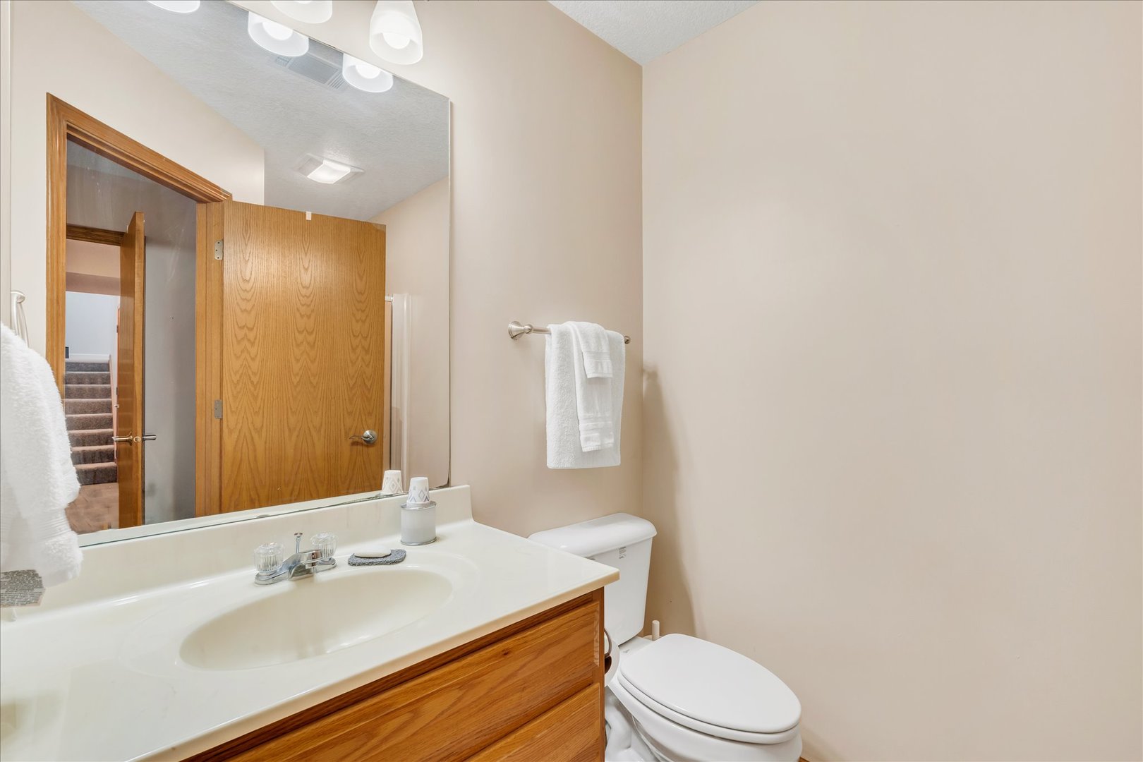 1223 33rd Ave Circle Silvis, IL 61282 - Photo 28 of 33 a bathroom with a sink vanity mirror and toilet