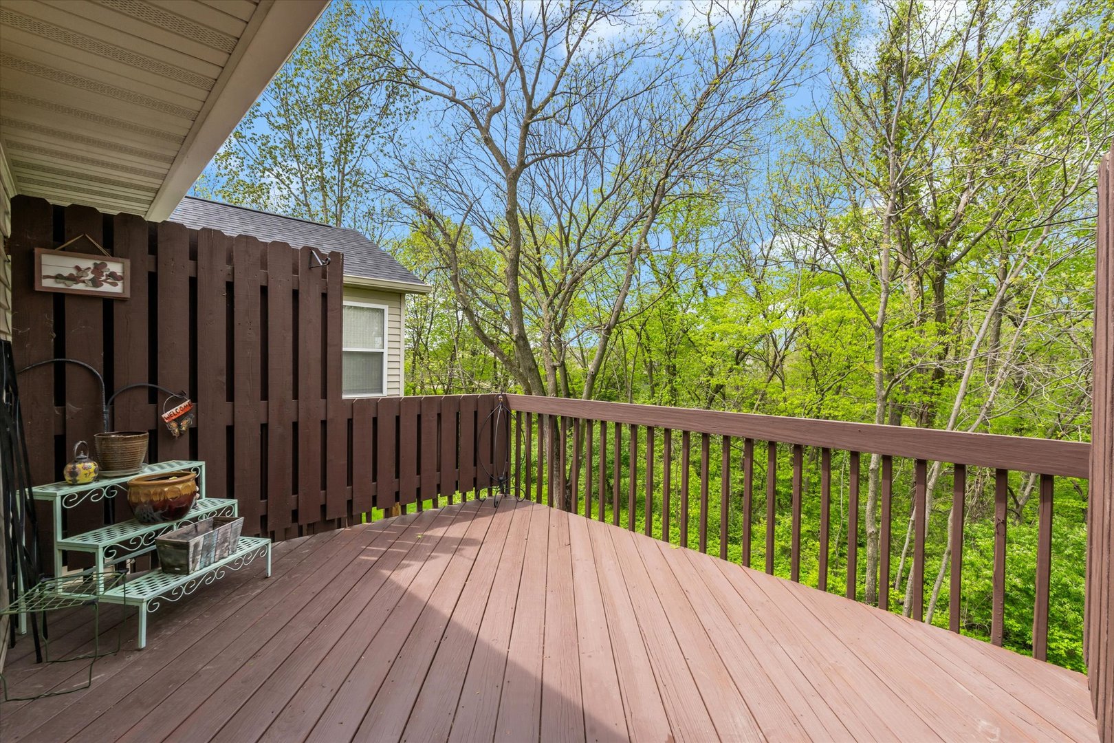 1223 33rd Ave Circle Silvis, IL 61282 - Photo 30 of 33 a balcony with wooden floor and outdoor seating