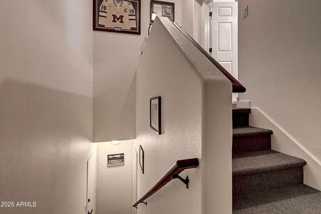 a view of a backyard with swimming pool and furniture