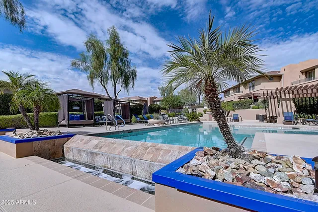 a view of a swimming pool with a patio