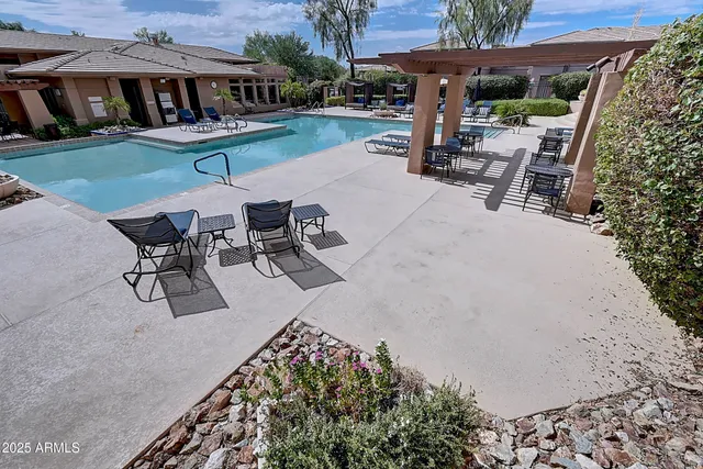 a view of a backyard with sitting area