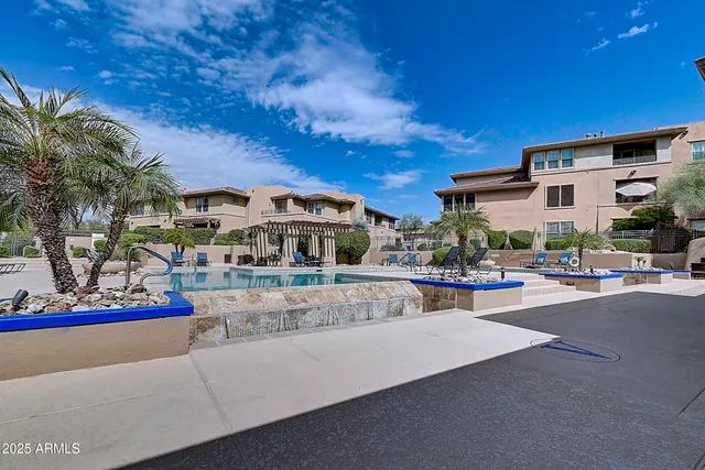 a view of a house with a yard patio and sitting area