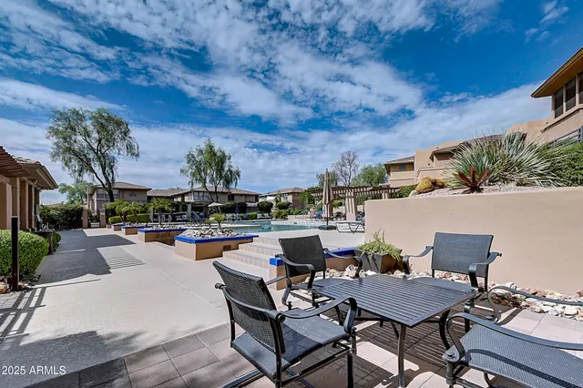 a view of a chairs and tables in the patio