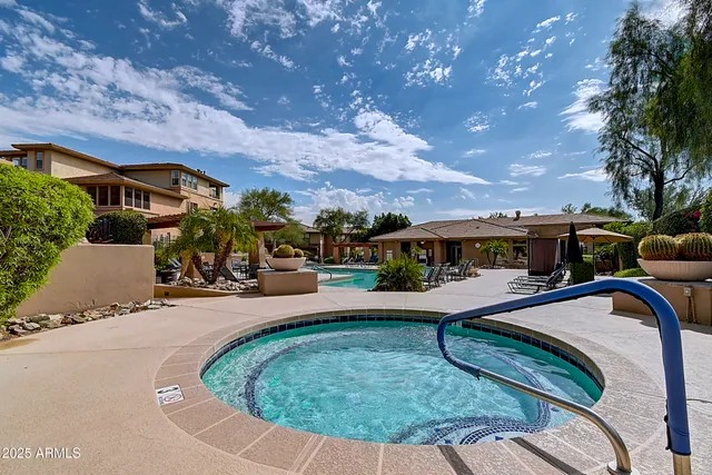a living room with furniture fireplace and flat screen tv