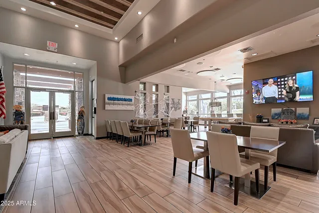 a front view of a brick house with a yard