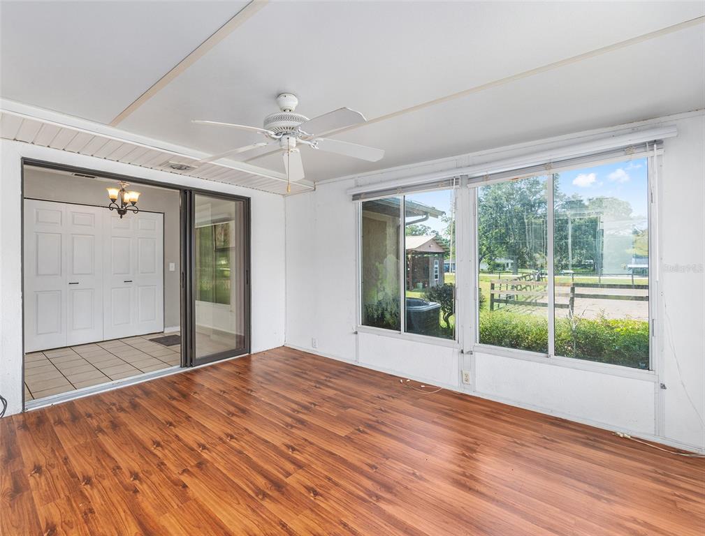 2227 Southwest 80th Avenue Ocala, FL 34481 - Photo 16 of 28 a view of an empty room with wooden floor and a window