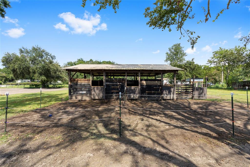 2227 Southwest 80th Avenue Ocala, FL 34481 - Photo 23 of 28 a view of a house with a yard