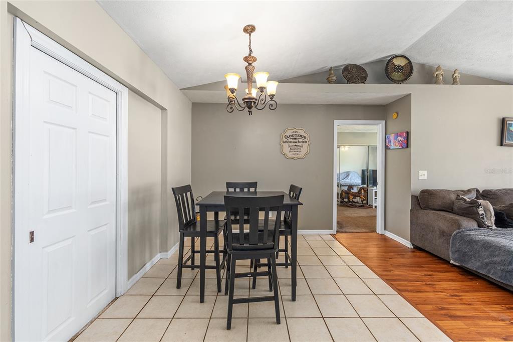 2227 Southwest 80th Avenue Ocala, FL 34481 - Photo 7 of 28 a view of a dining room with furniture and a chandelier