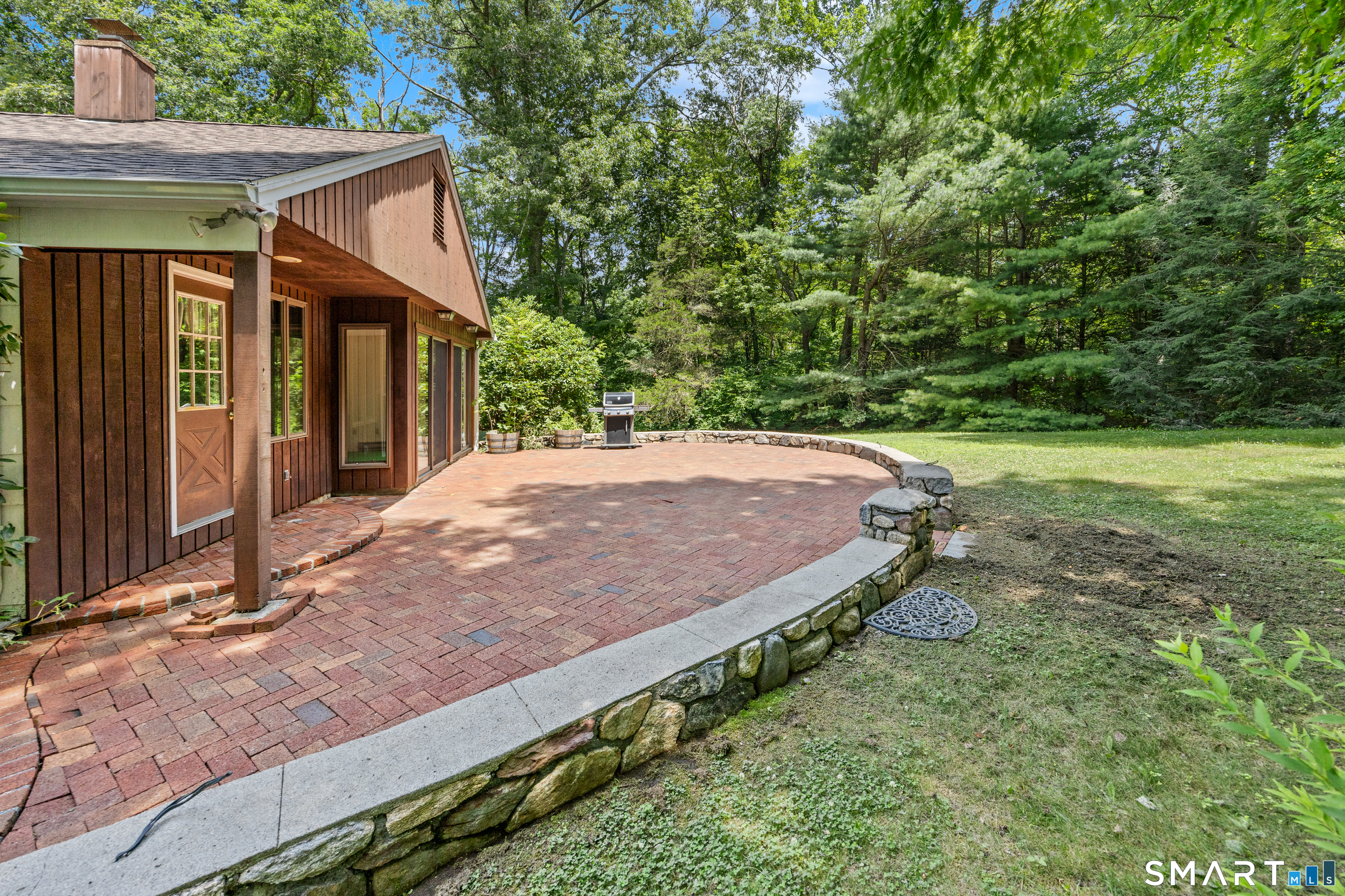 65 Munson Road Wolcott, CT 06716 - Photo 22 of 28 Brick patio off Sunroom and Kitchen