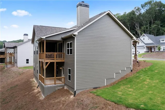 a bathroom with a granite countertop toilet sink and mirror