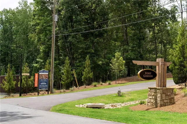 an aerial view of a house with garden space ocean view