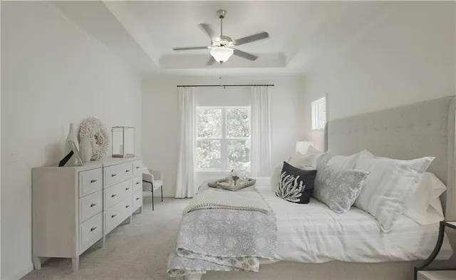 a bedroom with a bed and window