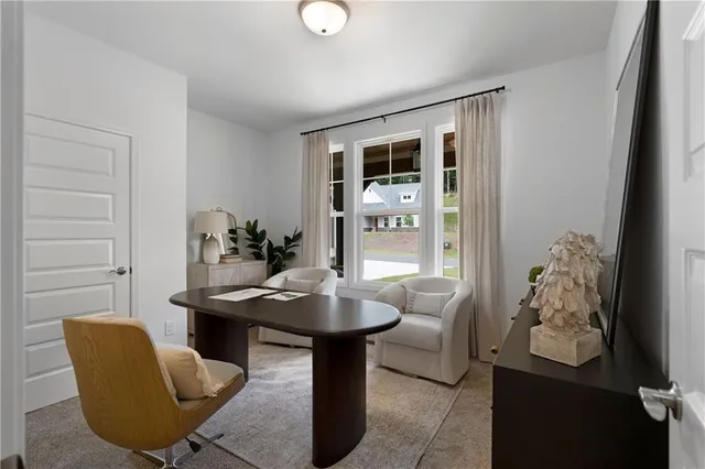 a dining room with furniture and window