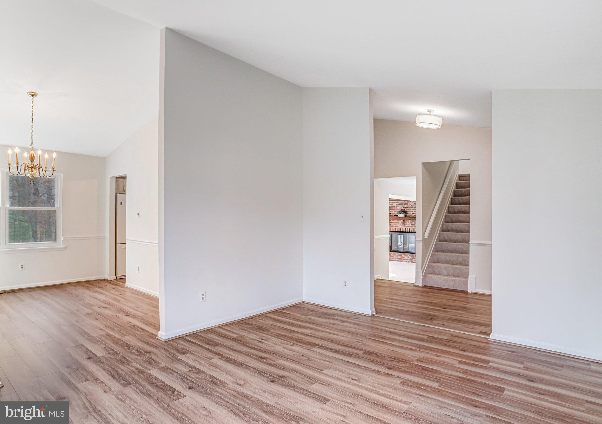 9019 Octavia Court Springfield, VA 22153 - Photo 14 of 54 Living room looking into foyer and stairs