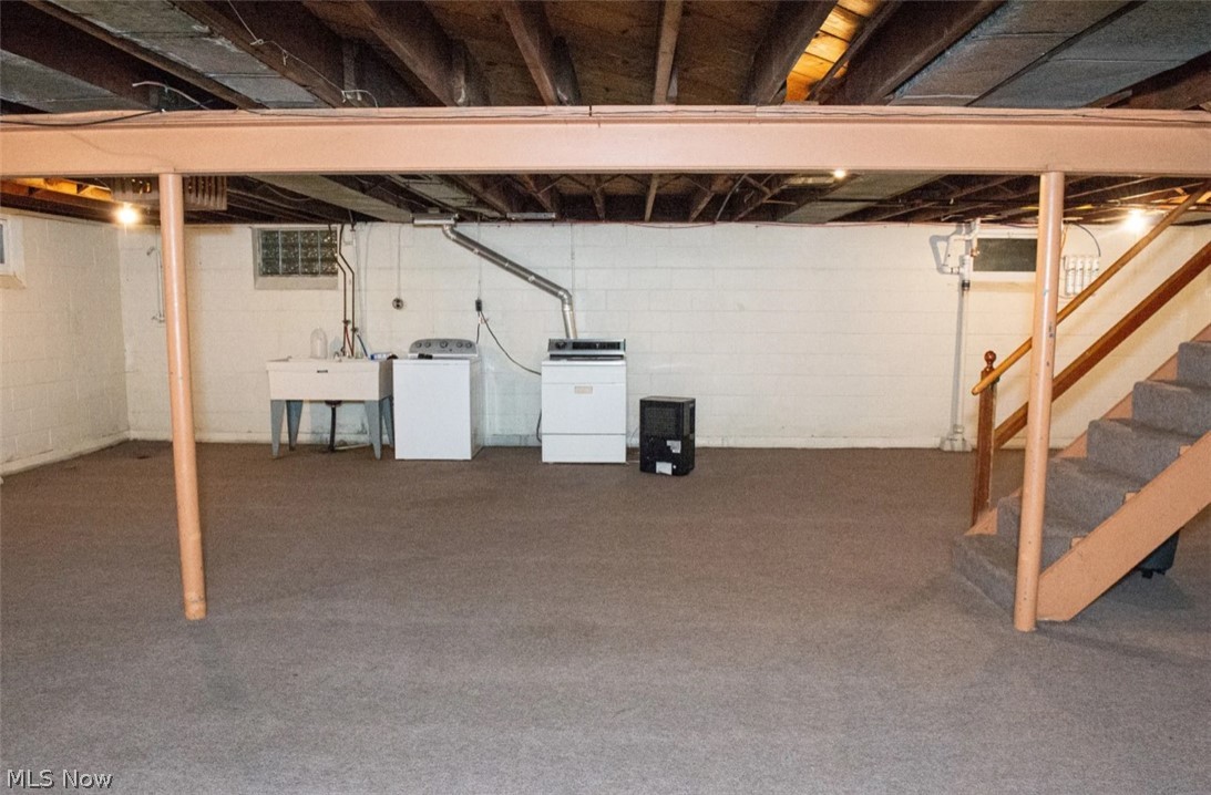 6714 Trenholm Road Youngstown, OH 44512 - Photo 16 of 22 Basement featuring washing machine and clothes dryer, carpet flooring, and sink