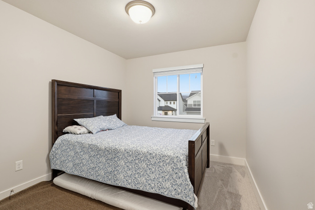 2011 Wren Circle Logan, UT 84339 - Photo 12 of 20 Bedroom featuring light colored carpet and baseboards