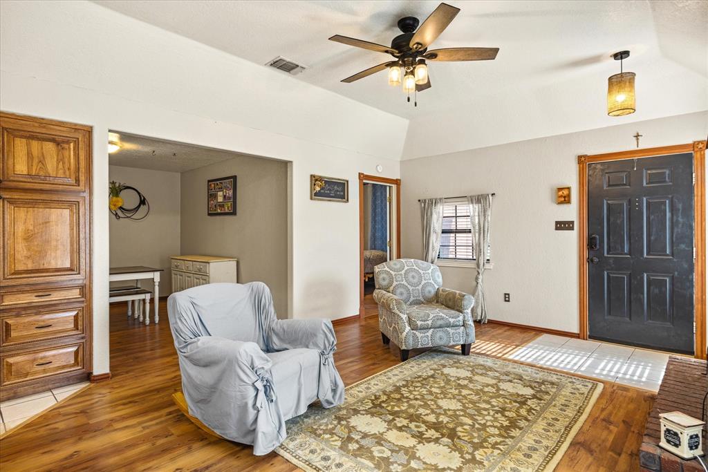 614 Overhill Road Granbury, TX 76048 - Photo 13 of 40 a living room with furniture and wooden floor