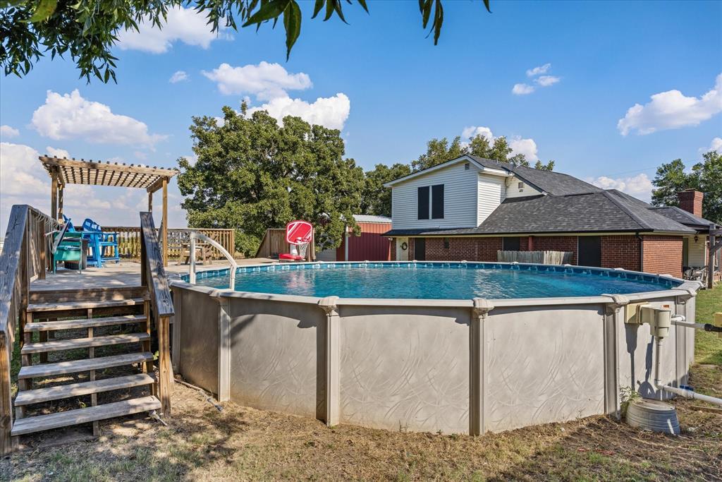 614 Overhill Road Granbury, TX 76048 - Photo 31 of 40 a front view of a house with a yard