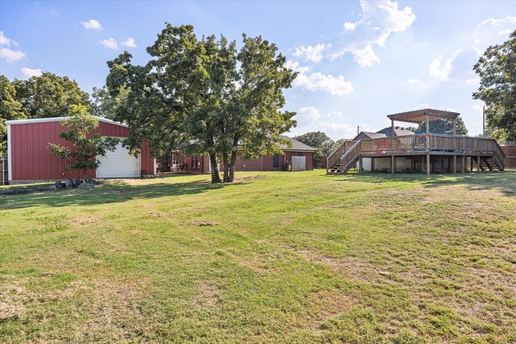 614 Overhill Road Granbury, TX 76048 - Photo 36 of 40 a swimming pool with lawn chairs and plants