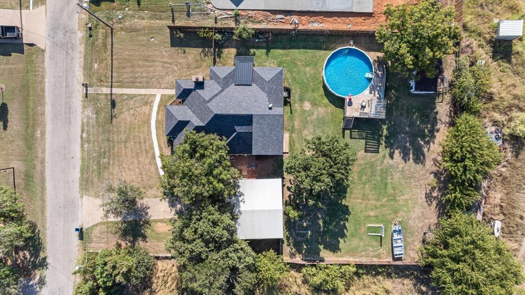 614 Overhill Road Granbury, TX 76048 - Photo 38 of 40 an aerial view of a house with outdoor space and street view