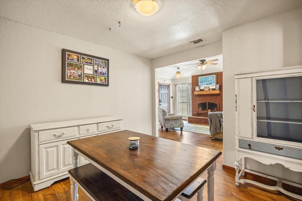 614 Overhill Road Granbury, TX 76048 - Photo 10 of 40 a view of a dining room with furniture and a window