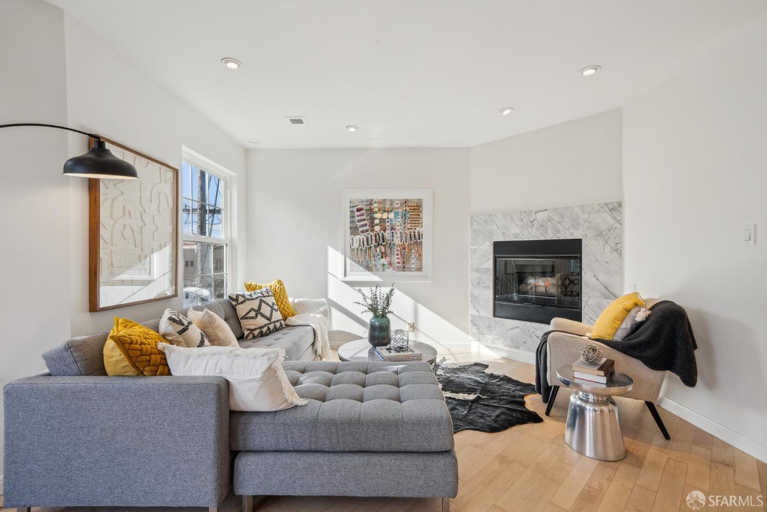 a living room with furniture and a fireplace