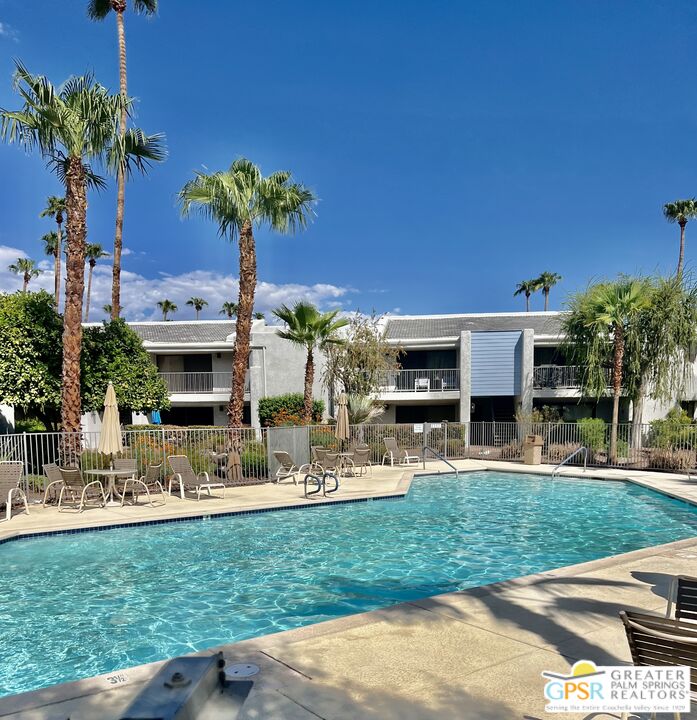 3155 Ramon Road, Unit 301 Palm Springs, CA 92264 - Photo 2 of 3 a front view of a house with garden