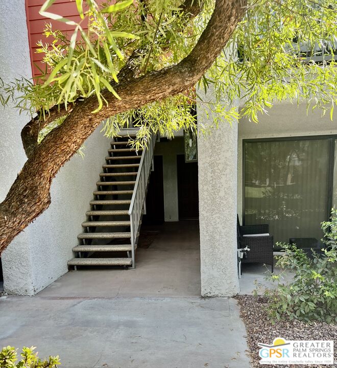 3155 Ramon Road, Unit 301 Palm Springs, CA 92264 - Photo 3 of 3 a view of a house with backyard and wooden fence