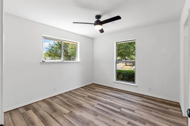 a view of room with window and ceiling fan