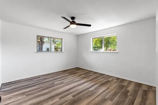 a view of empty room with windows