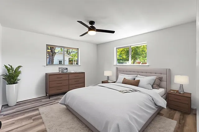 a bedroom with a large bed and a dresser