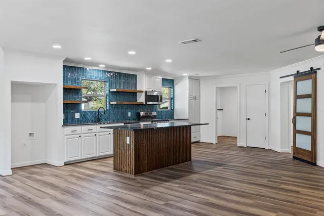 a view of kitchen with wooden floor