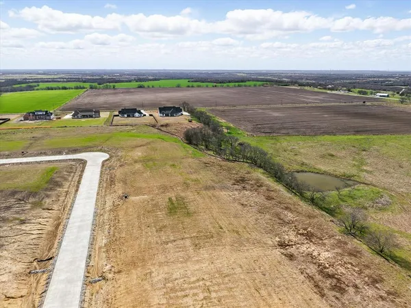 a view of a lake with a big yard
