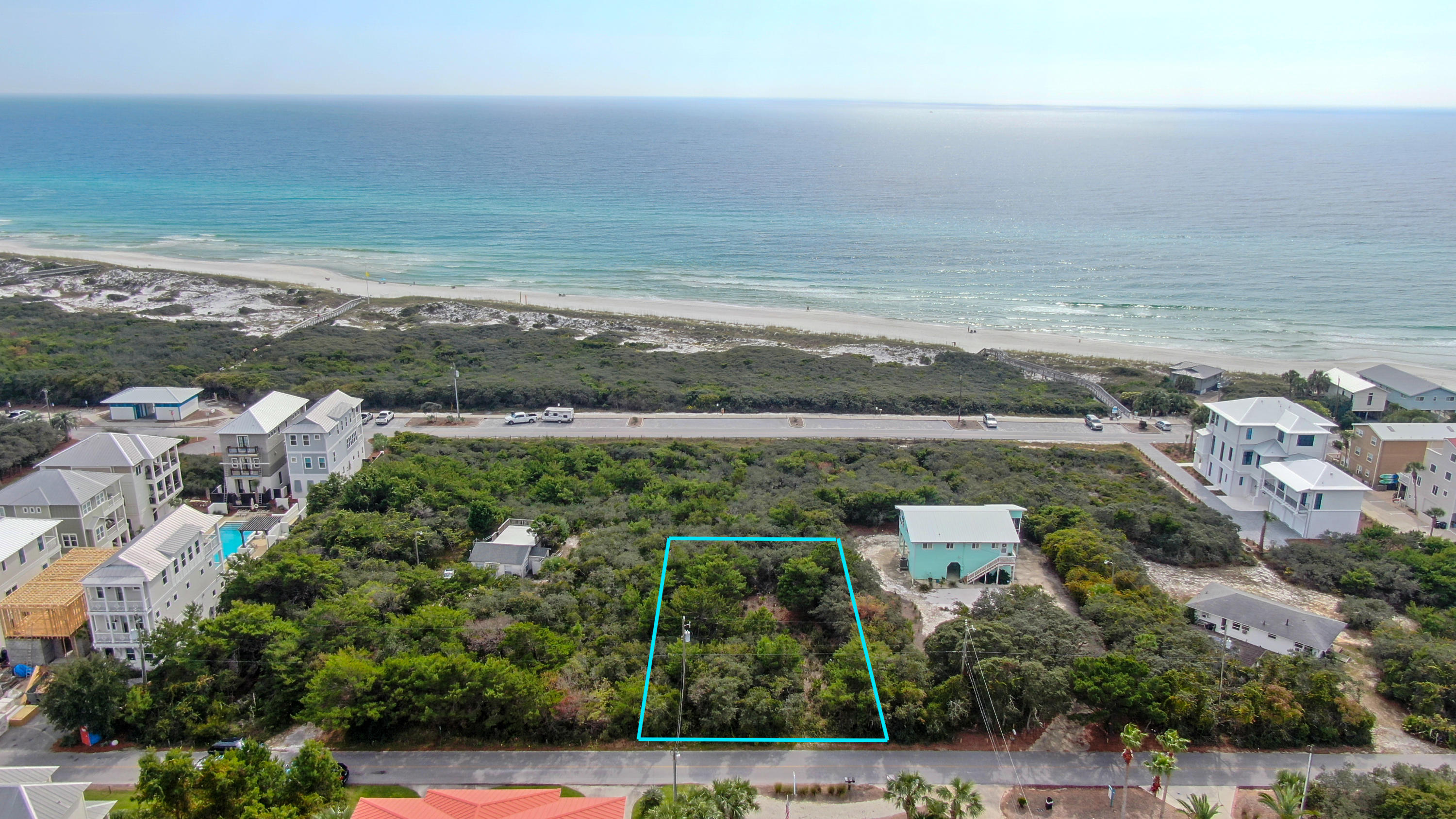 an aerial view of residential building and ocean