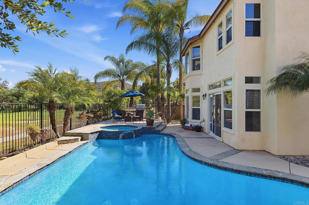 2414 Fallbrook Place Escondido, CA 92027 - Photo 11 of 63 a view of a house with swimming pool and sitting area