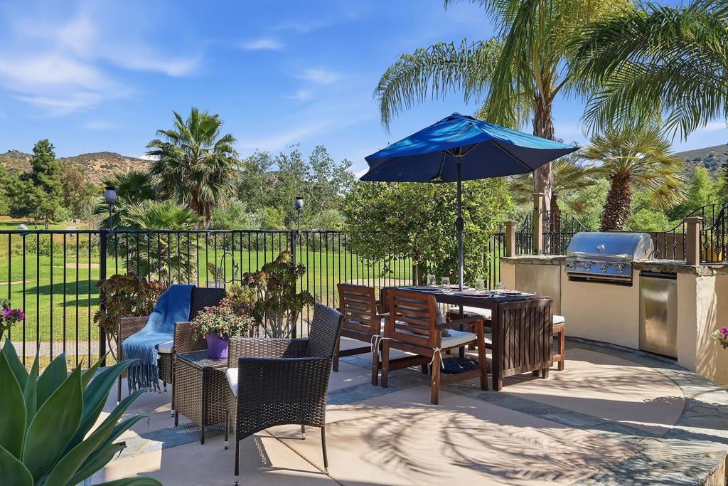 2414 Fallbrook Place Escondido, CA 92027 - Photo 15 of 63 a view of a chairs and table in patio