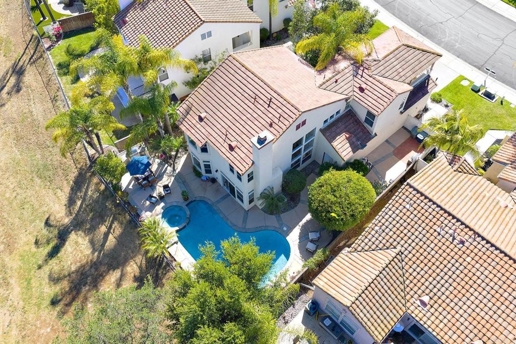 2414 Fallbrook Place Escondido, CA 92027 - Photo 22 of 63 an aerial view of a house with a yard and potted plants