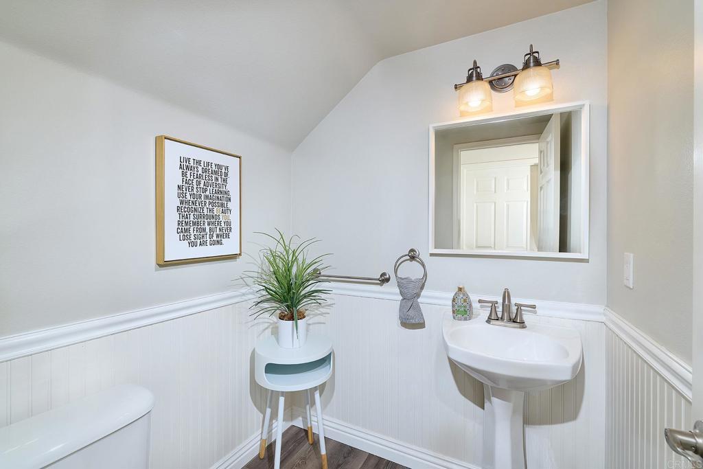 2414 Fallbrook Place Escondido, CA 92027 - Photo 35 of 63 a bathroom with a sink and a mirror