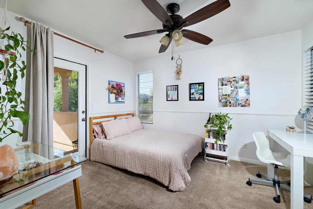 2414 Fallbrook Place Escondido, CA 92027 - Photo 39 of 63 a bedroom with a bed a couch and a potted plant