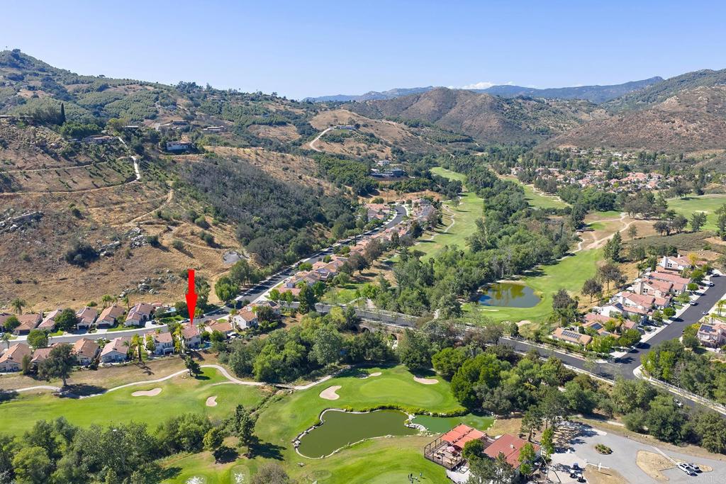 2414 Fallbrook Place Escondido, CA 92027 - Photo 57 of 63 an aerial view of a houses with a lush green hillside